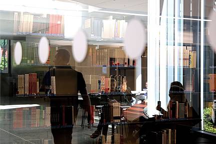 a view of LUX Library through a window
